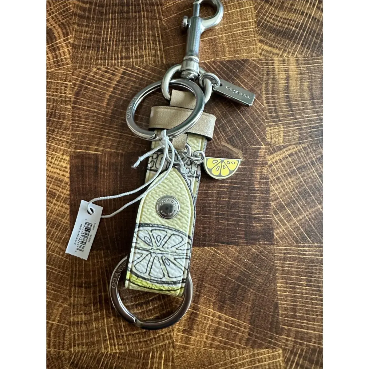 Trigger Snap Bag Charm Refined Calf Leather Key Cha Lemon Print CA047 by Coach