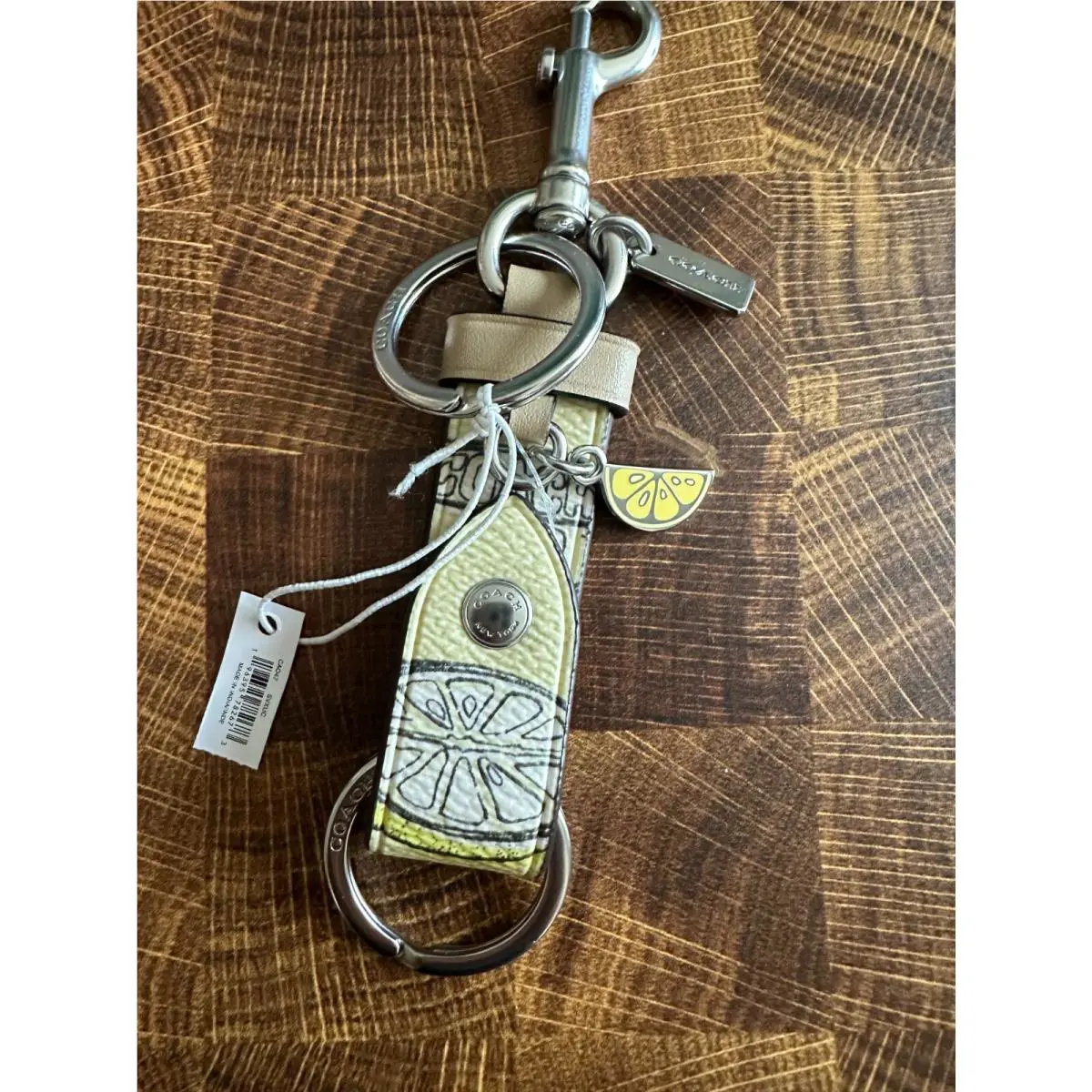 Trigger Snap Bag Charm Refined Calf Leather Key Cha Lemon Print CA047 by Coach