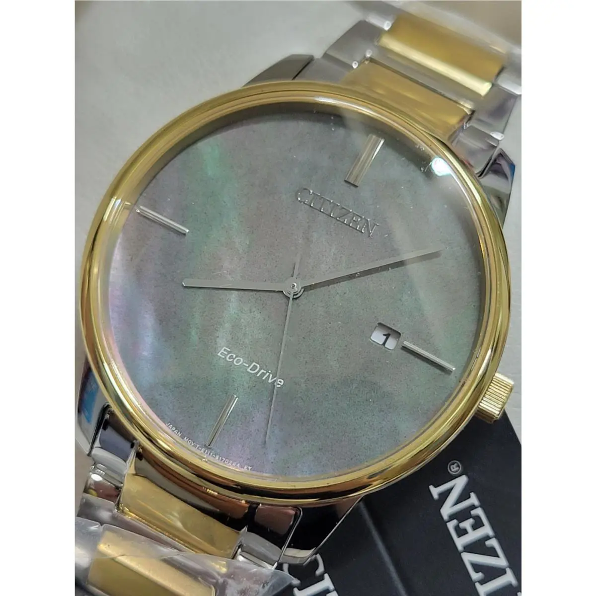 Citizen Eco-drive Women`s Silver Gold Date Indicator Watch 39MM BM7524-87Y