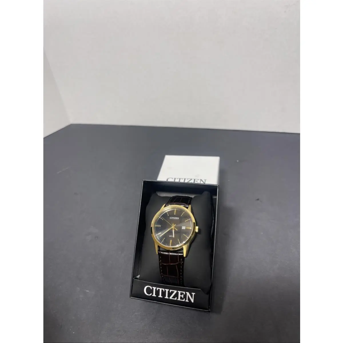 Citizen BI1033-04E Men`s Quartz Gold Tone Leather Band Black Dial Date Watch