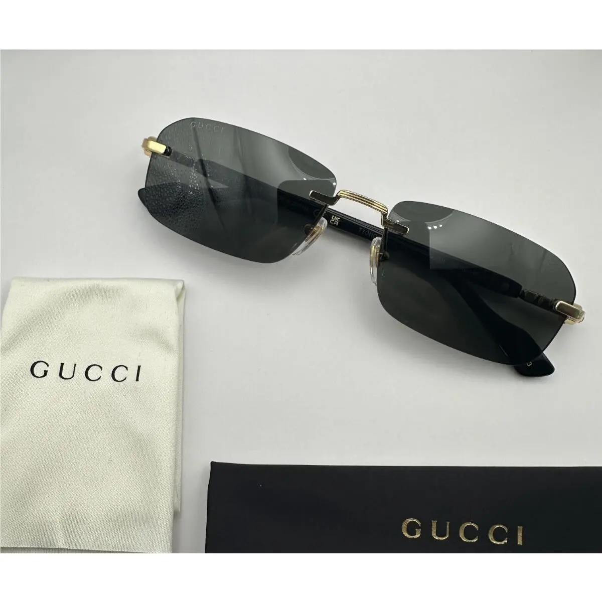 GG1221s Men Sunglasses Rimless Rectangle Gold Black Metal Frame Gray Lens by Gucci
