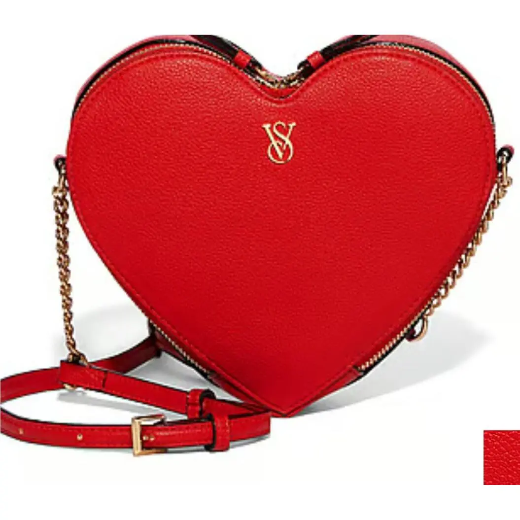 Victoria`s Secret Heart Shape Crossbody Bag. Bright Red. 2 Part Zipper - Handle/Strap: Red, Hardware: Gold Tone, Exterior: Bright Red