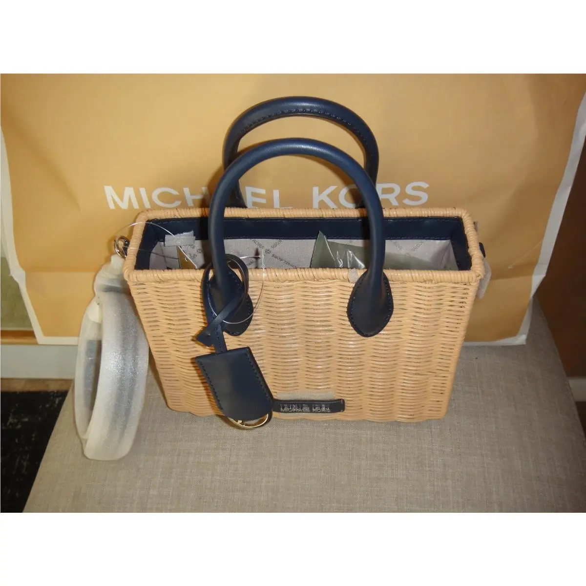 Michael Kors Small Mirella Wicker Shopper Top Handle Crossbody Bag.$678.00