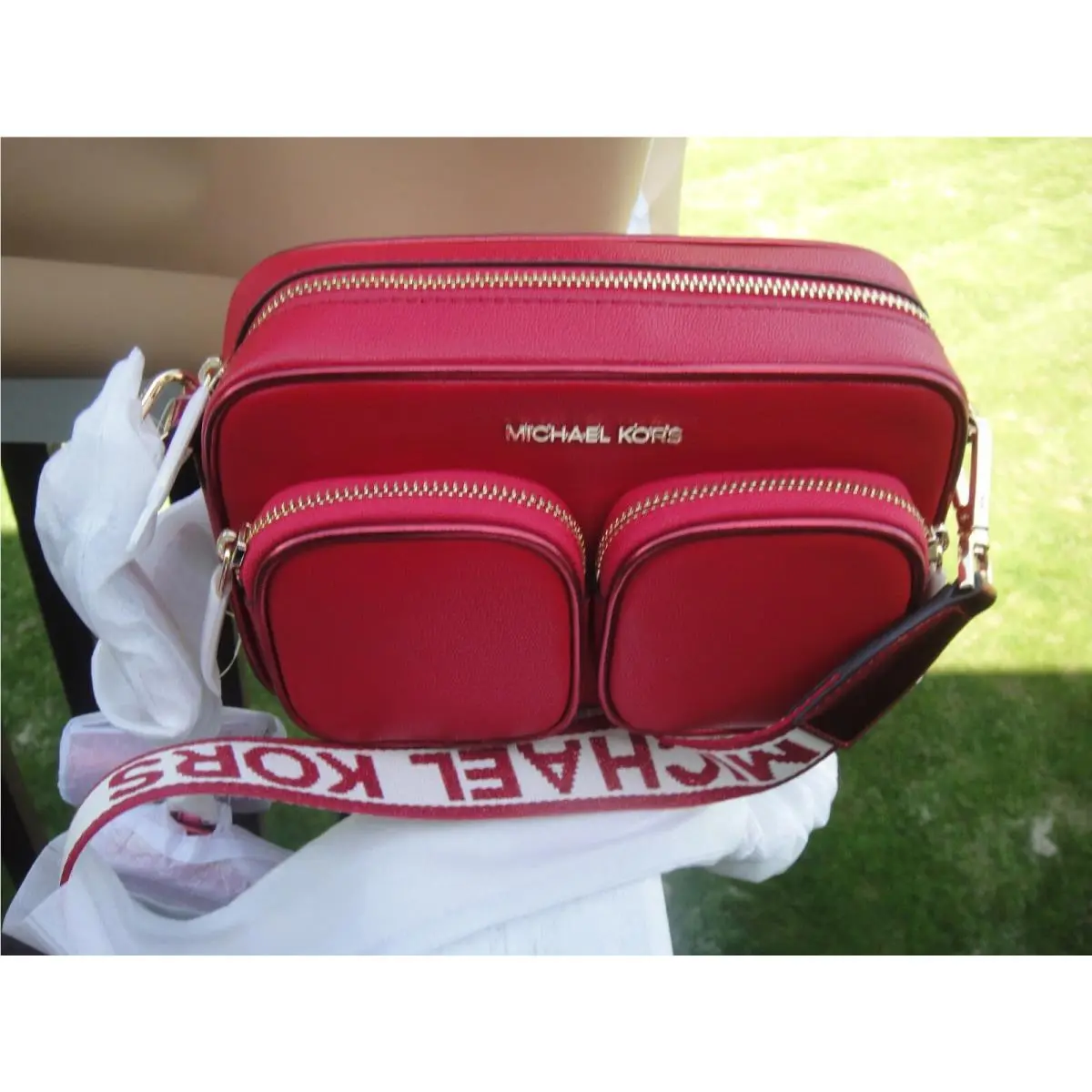 Michael Kors Jet Set Med Pkt Leather X Body with Tech Attached.msrp