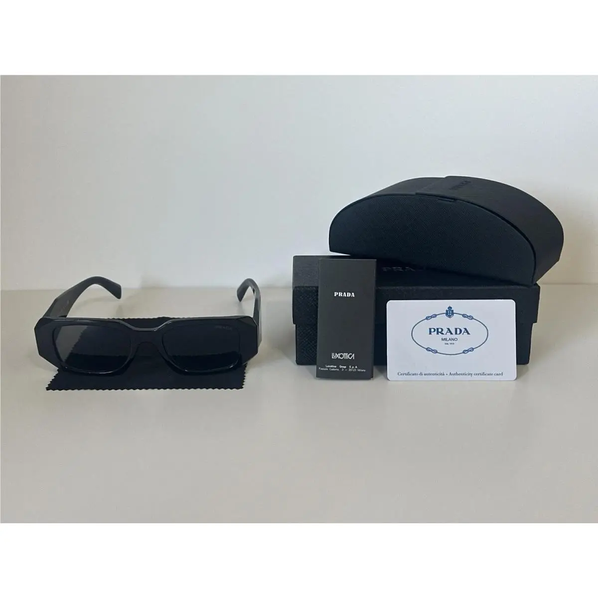 PR17WS Black Frame Sunglasses with Dark Grey Lenses – by Prada