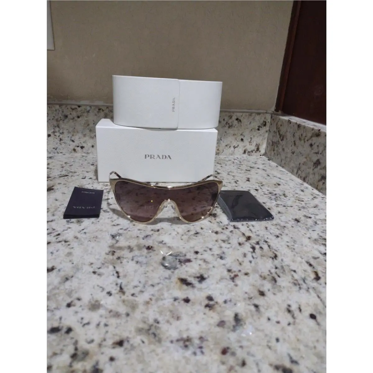 Prada Woman Sunglasses Spr 72v Gold Frame Brown Lenses