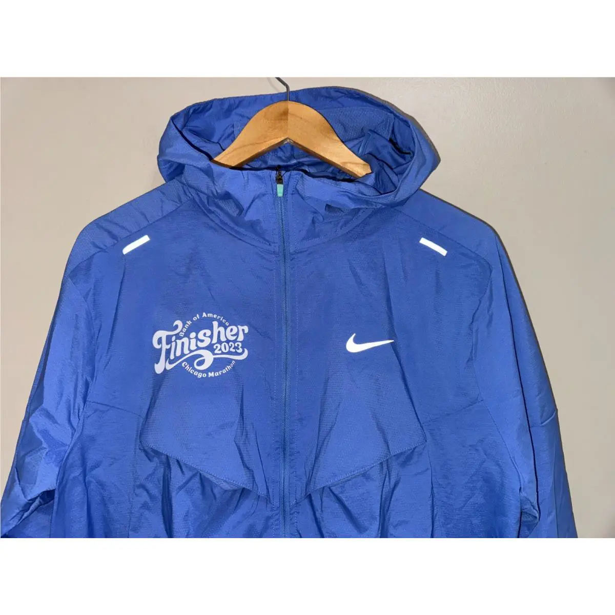 Nike clothing - Nike Windrunner Hooded Repel UV Protection Running Jacket - FD2703-450 - Polar (UPC: 196606976853) 0