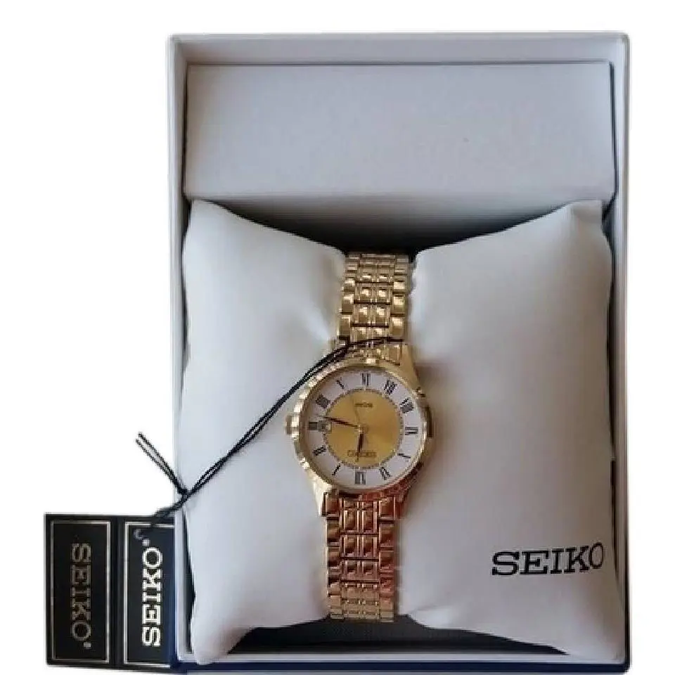 Seiko SXDC44 Women`s Round Roman Numeral Date Analog Gold Tone Watch