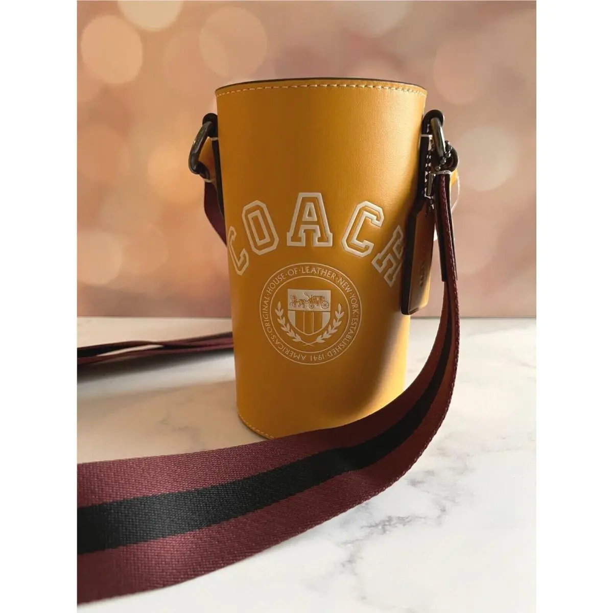 BN  Crossbody Water Bottle with Varsity Motif Leather with Strap by Coach