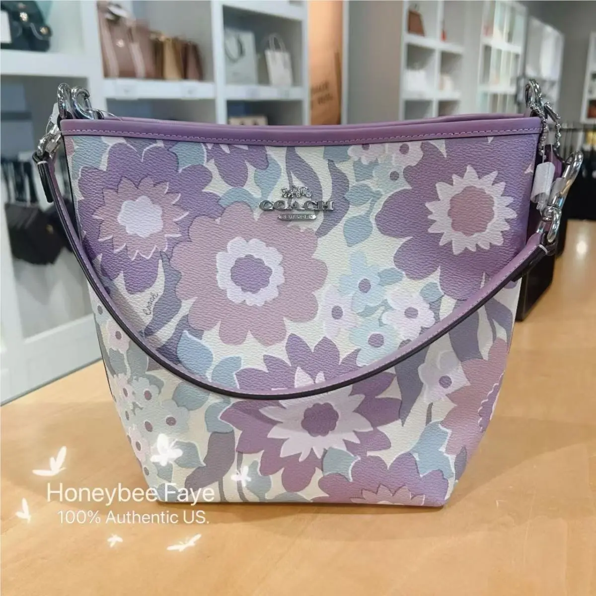 City Bucket Bag In Signature Canvas with Bow / Floral/shell/observed CBG77 Sv/Ivory/Purple Multi by Coach