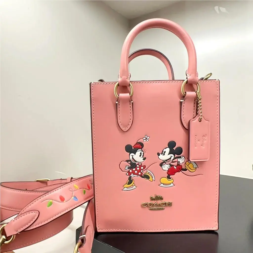 X Disney North South Mini Tote with Sled Motif/minnie Mouse/ice Skate CN023/Light Blush Multi by Coach