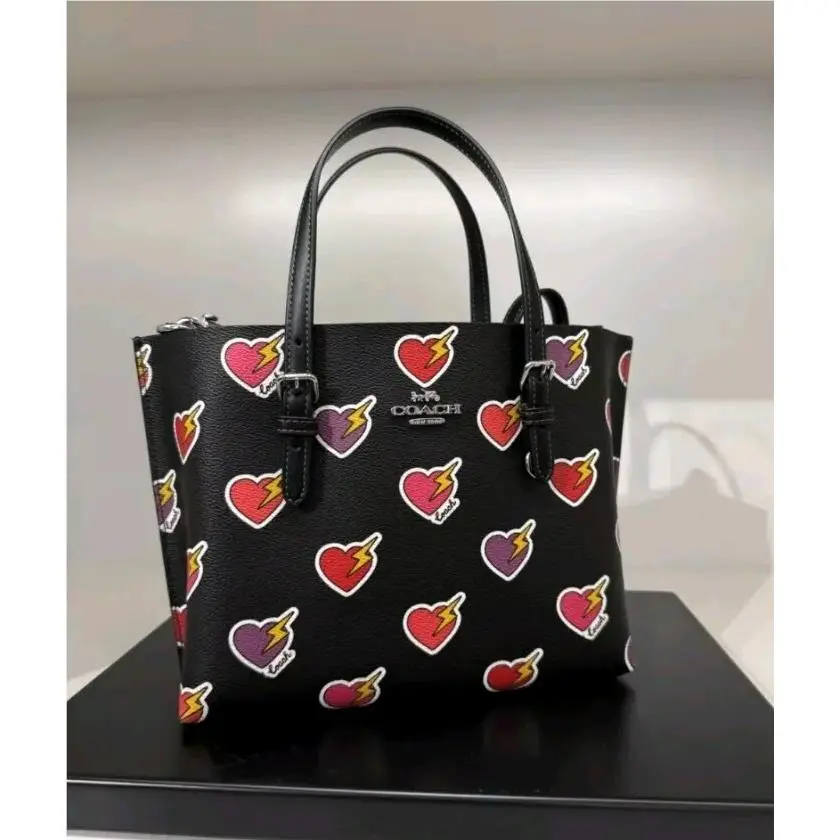 CW435 Mollie Tote Bag 25 In Signature Canvas with Heart Bolt Print by Coach