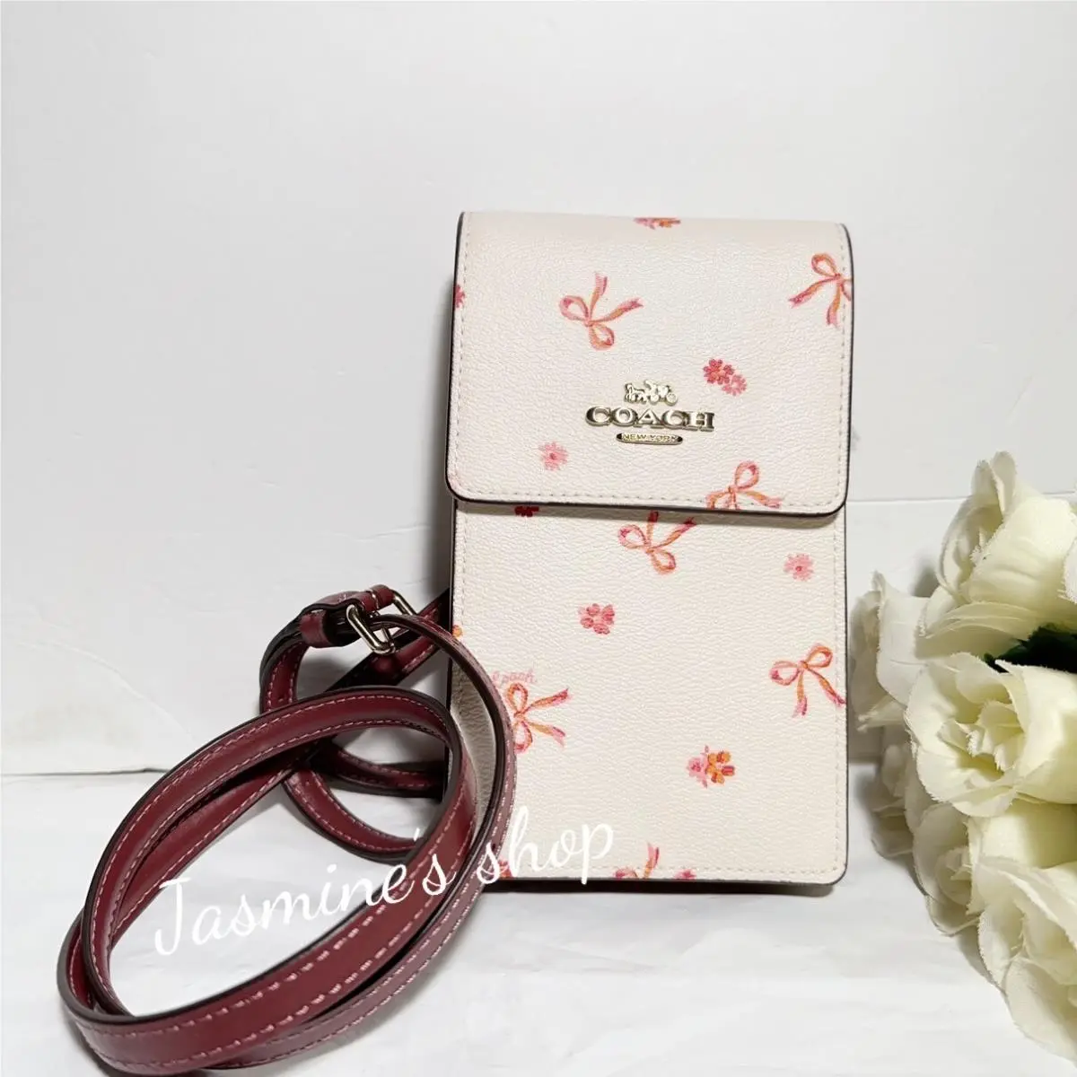 CN780 North South Phone Crossbody with Bow Print Chalk/wine Multi by Coach