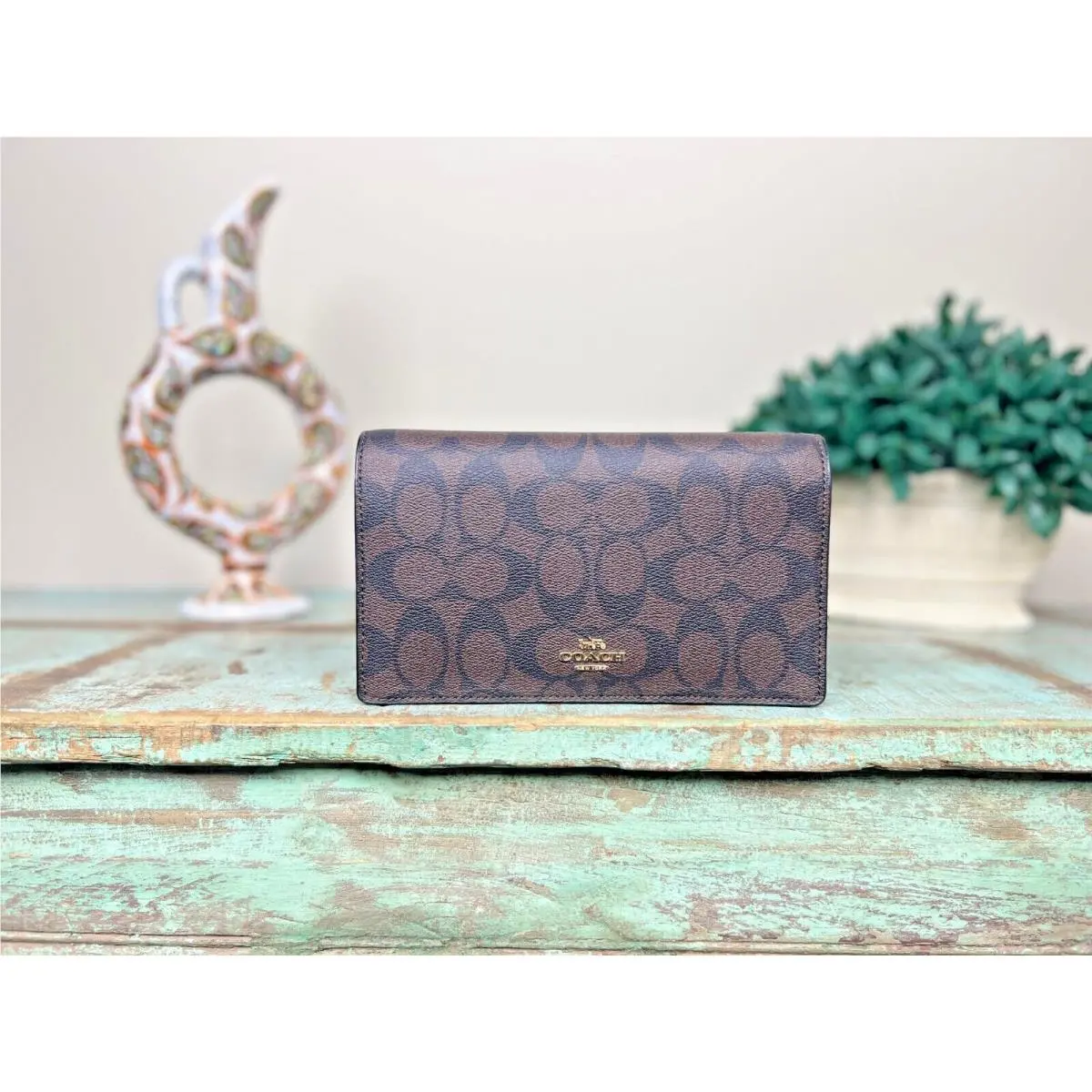 Coach Anna Foldover Crossbody Clutch in Signature Canvas in Brown/black 3036
