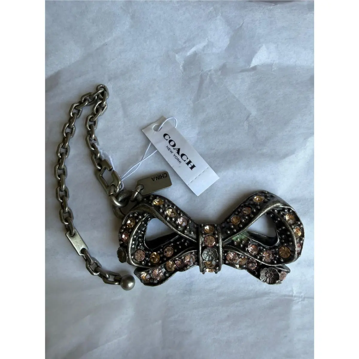 Selena Gomez Crystal Bow Bag Charm with Puzzle Chain Key Fob 39311 by Coach