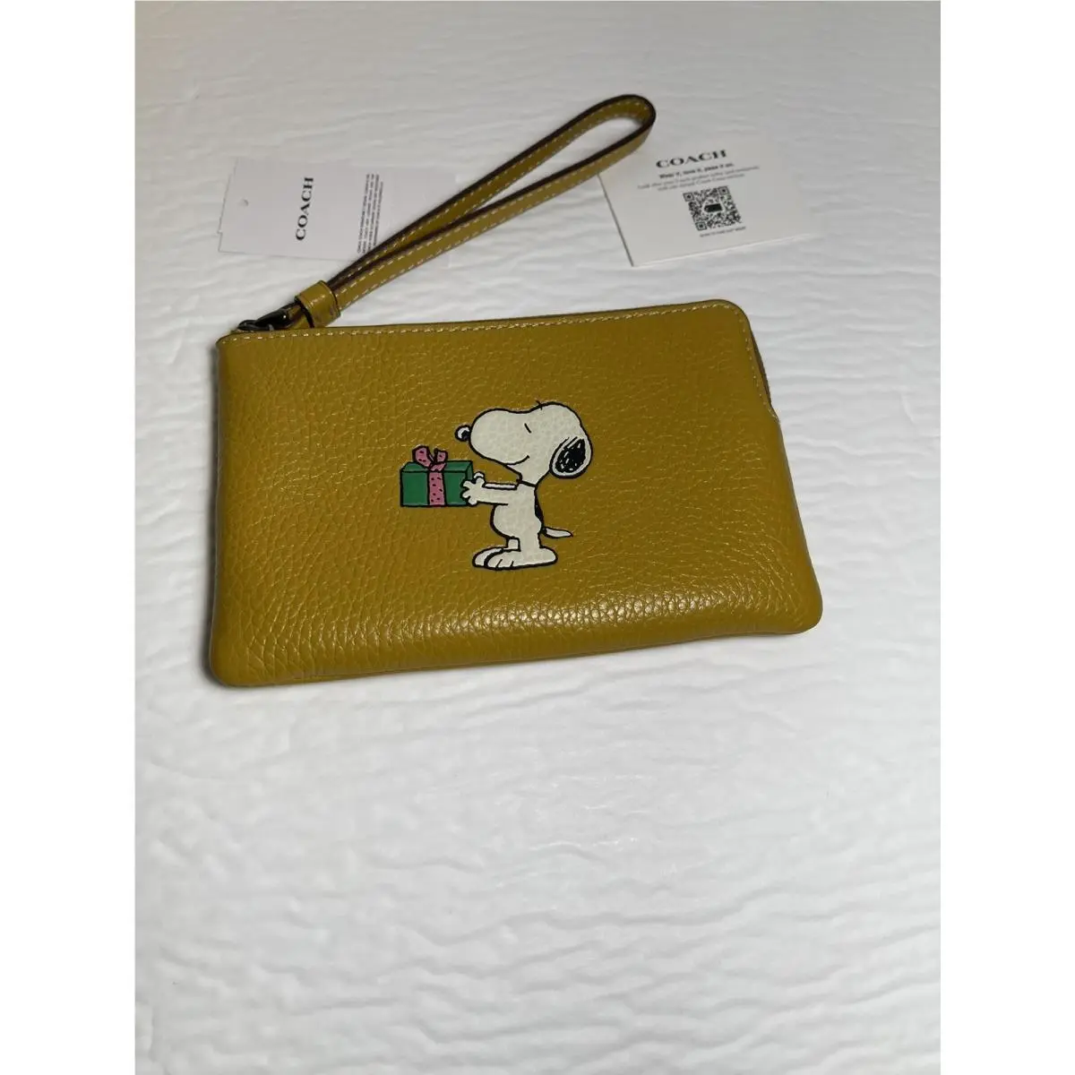 CF215  X Peanuts Corner Zip Wristlet with Snoopy Present Motif by Coach