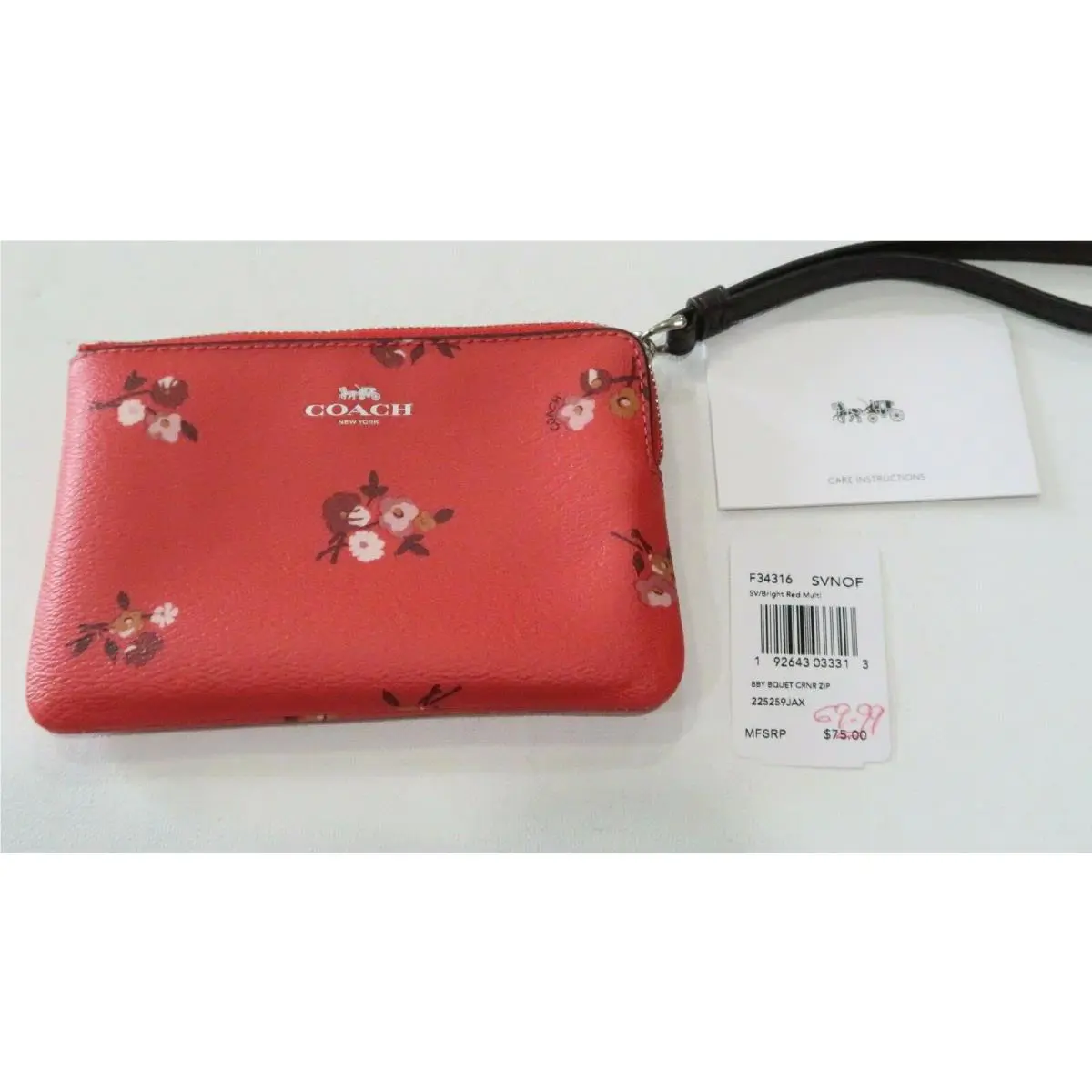 Wristlet in Red with Flowers and a Brown Strap by Coach