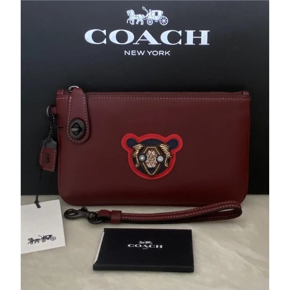 Coach Bordeaux Leather Varsity Patch Turnlock Wristlet 21 57180