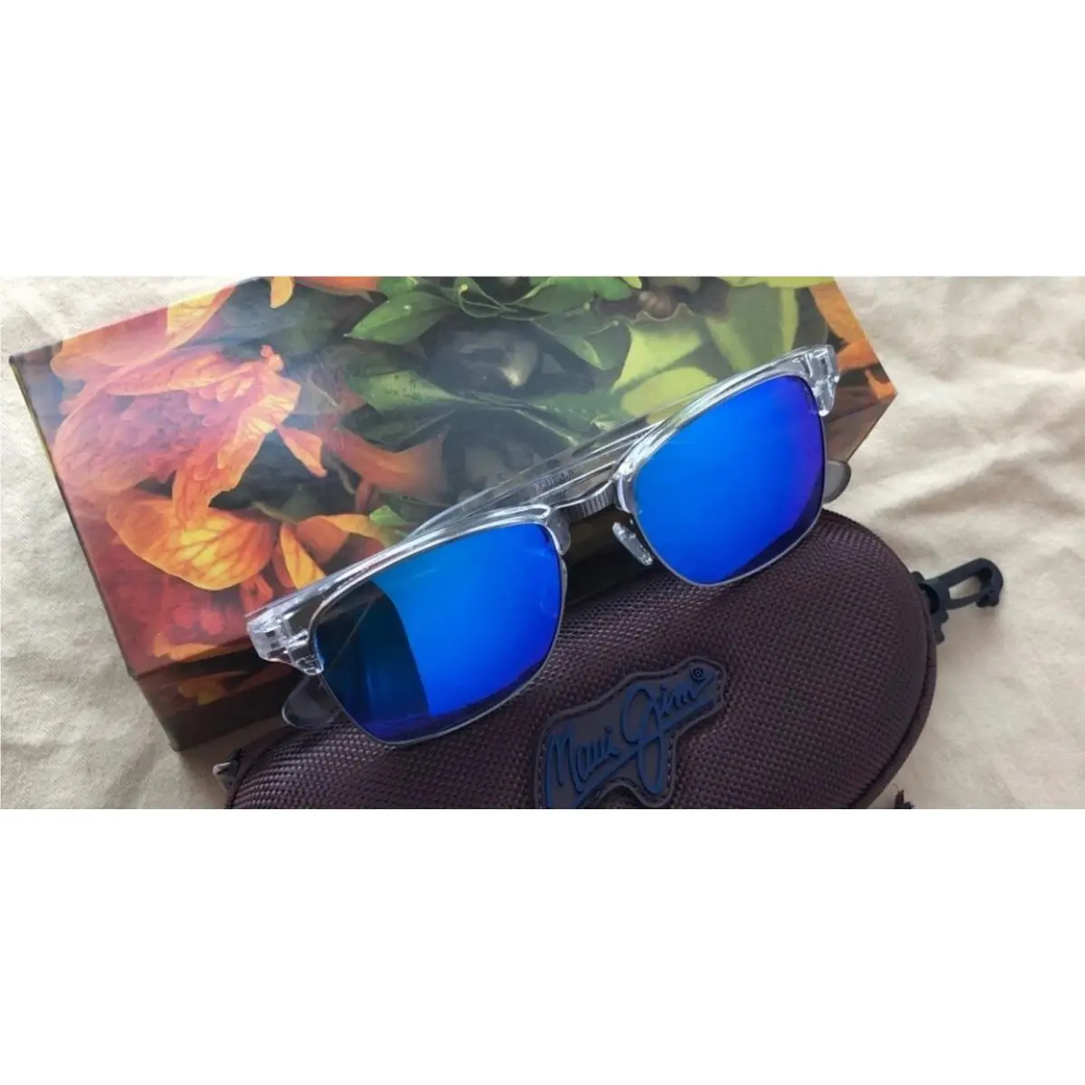 Maui Jim B25705CR Sunglasses with Polarized Lenses - Crystal/blue Hawaii - Frame: Clear, Lens: Blue