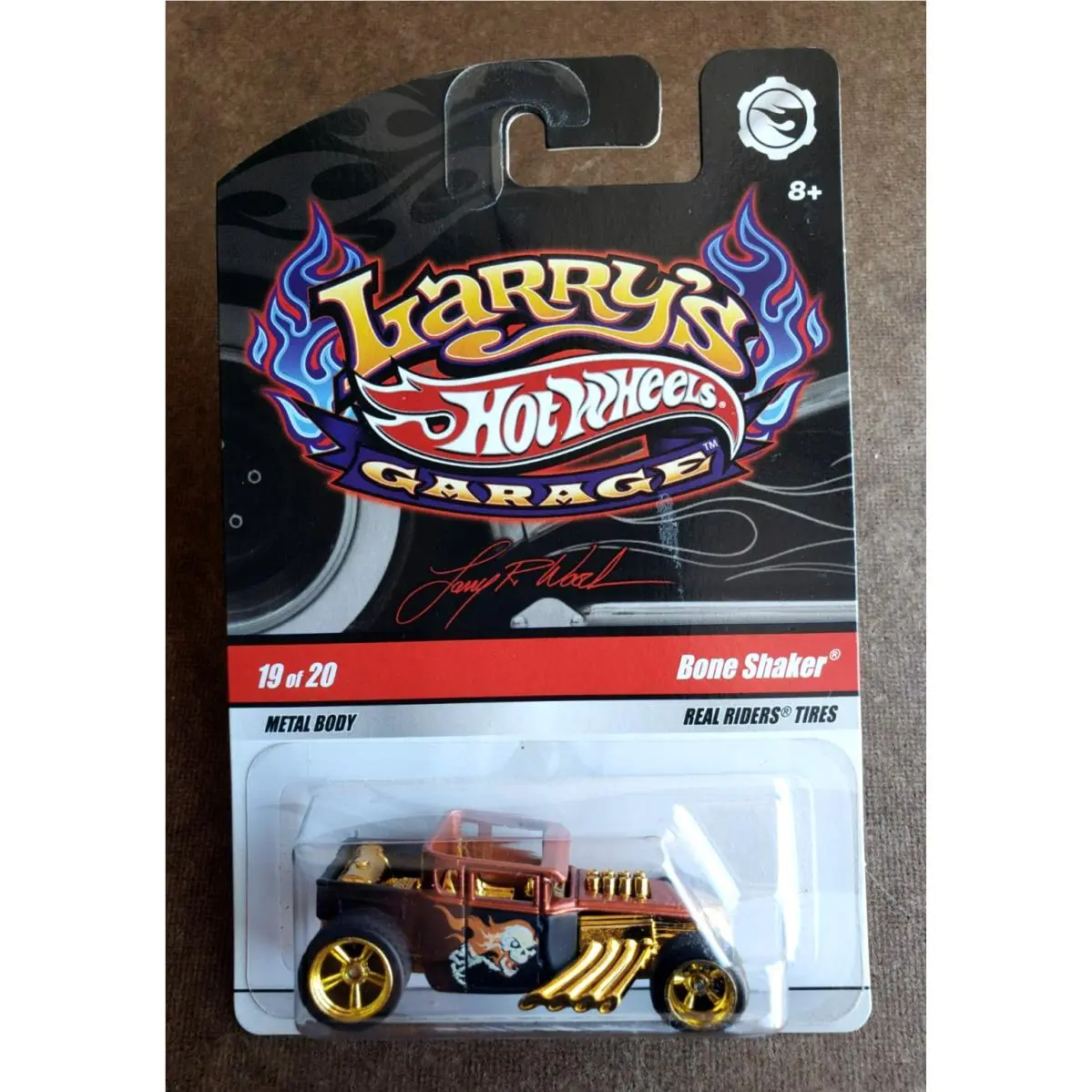 2009 Hot Wheels Bone Shaker Mtflk Brown Black Larry`s Garage 1:64 RR 5SP LW Sign