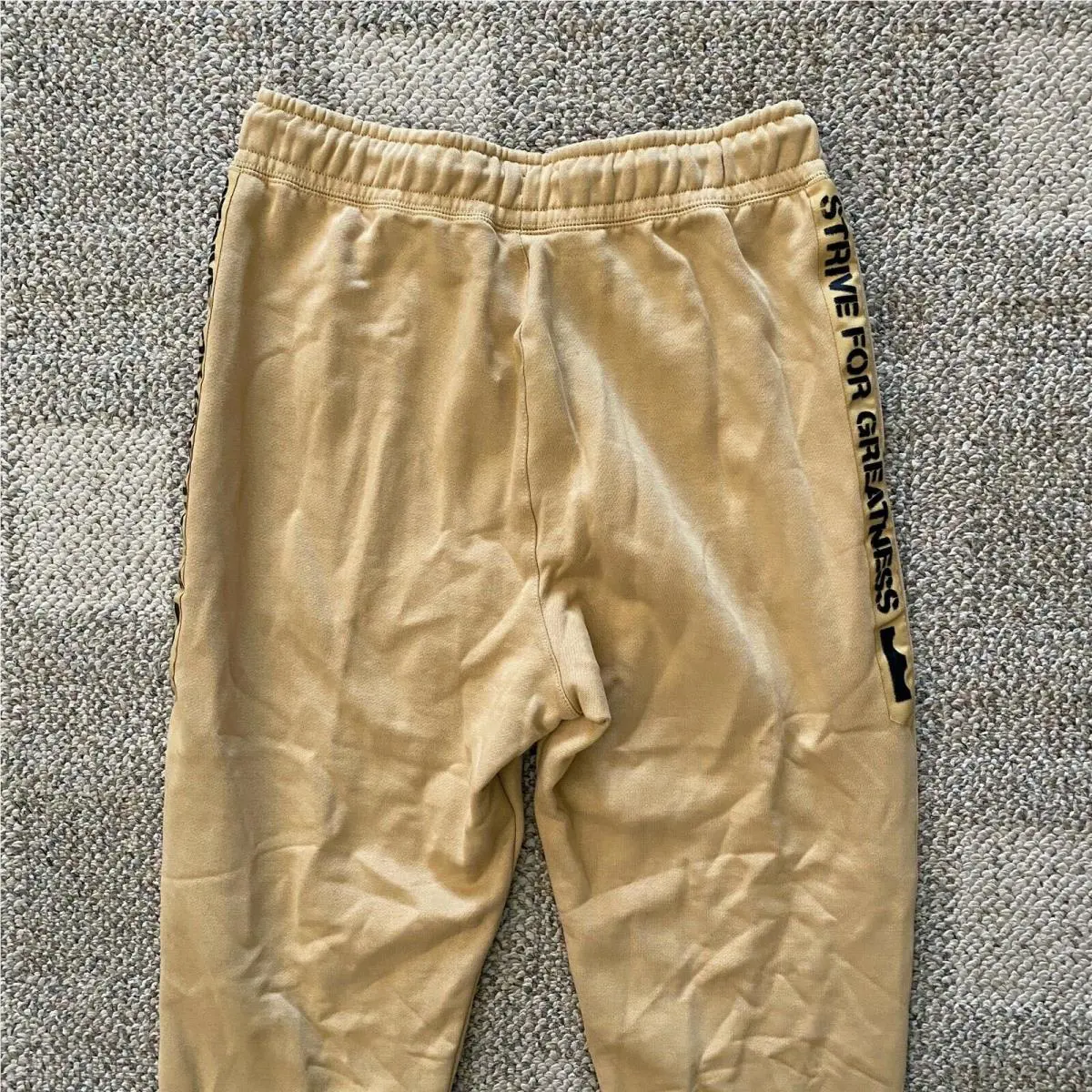 Nike clothing - Gold/Black (UPC: 193151057006) 1