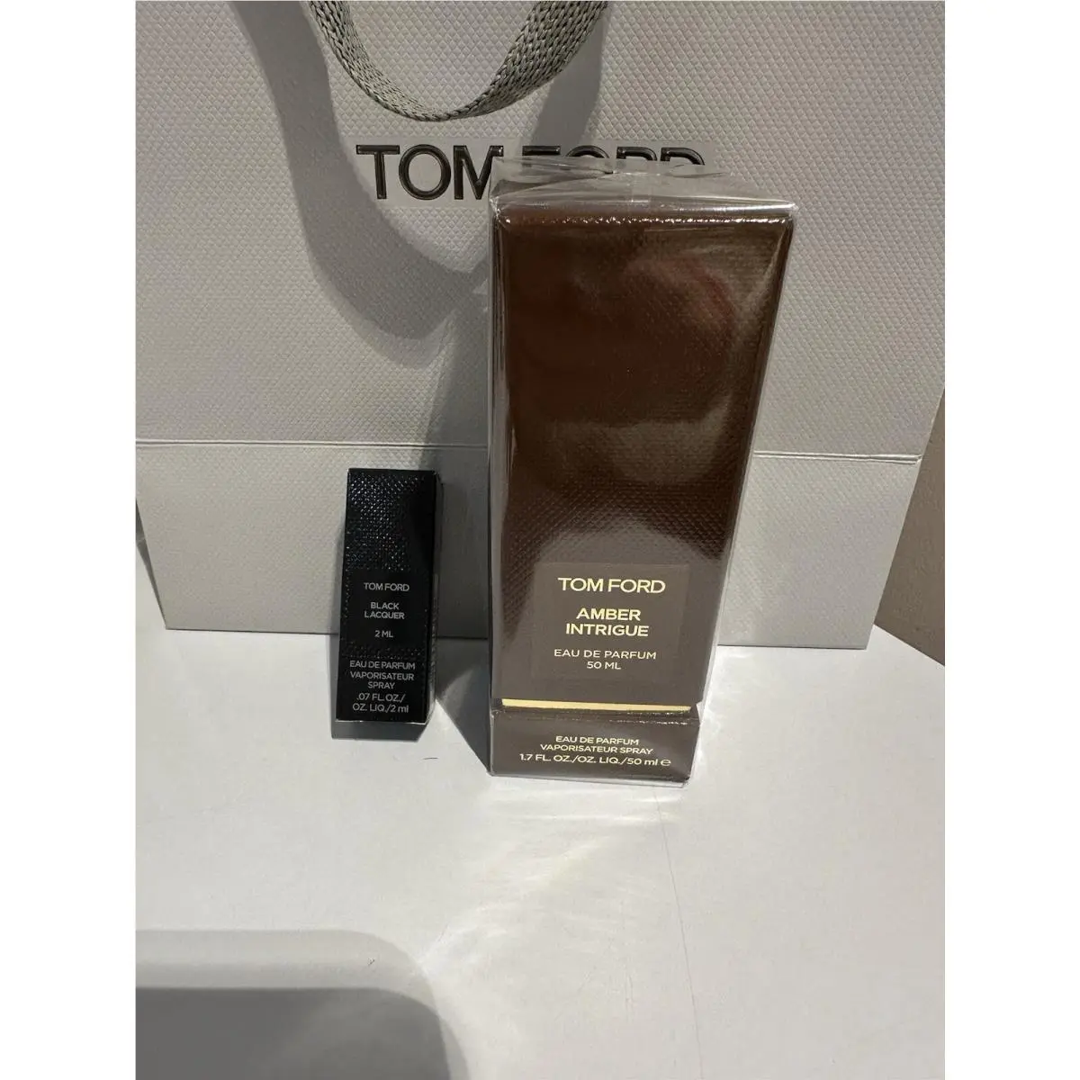 50ml  Amber Intrigue and a 2ml Sample of Black Lacquer by Tom Ford