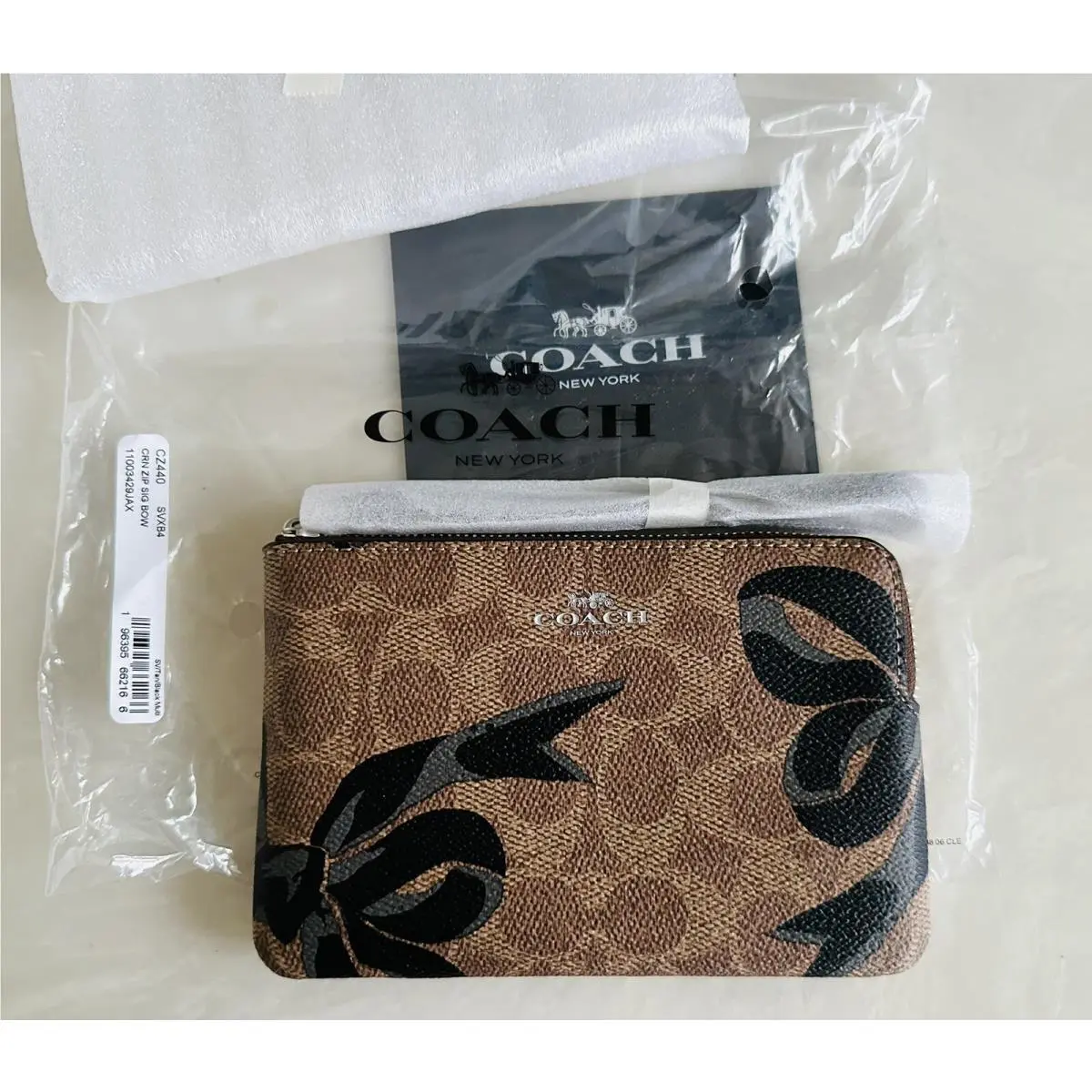 Coach Bow Corner Zip Wristlet Tan/black Signature Coated Canvas CZ440