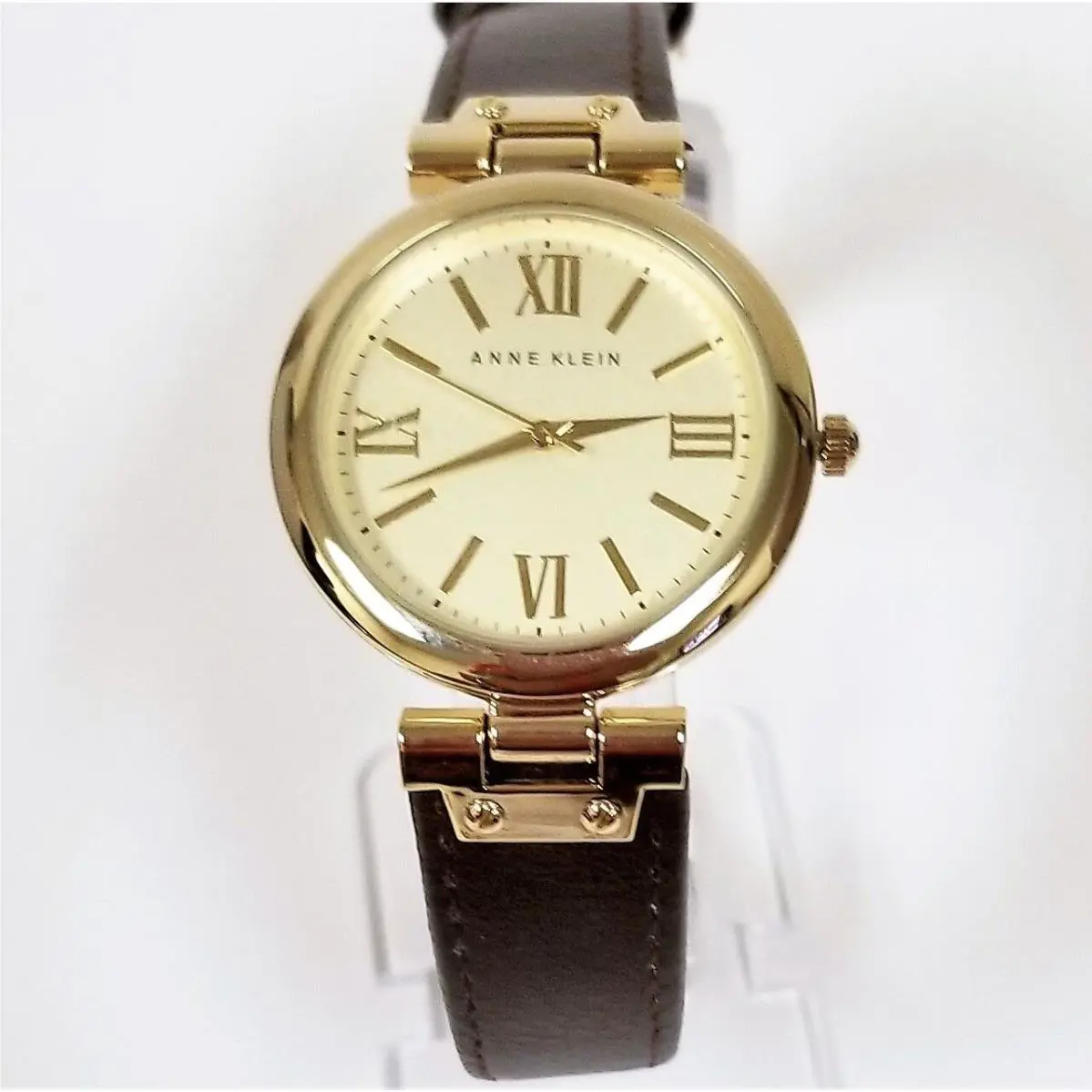 Anne Klein Gold Tone Brown Leather Backing Roman Numerals Watch AK/1856