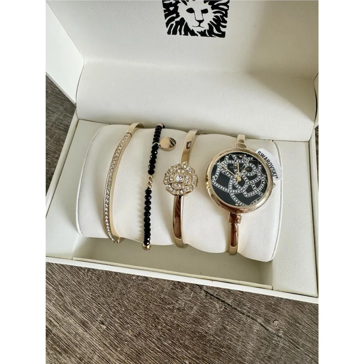 Anne Klein Women`s AK/3080GBST Premium Crystal Accented Gold-tone Bangle Watch