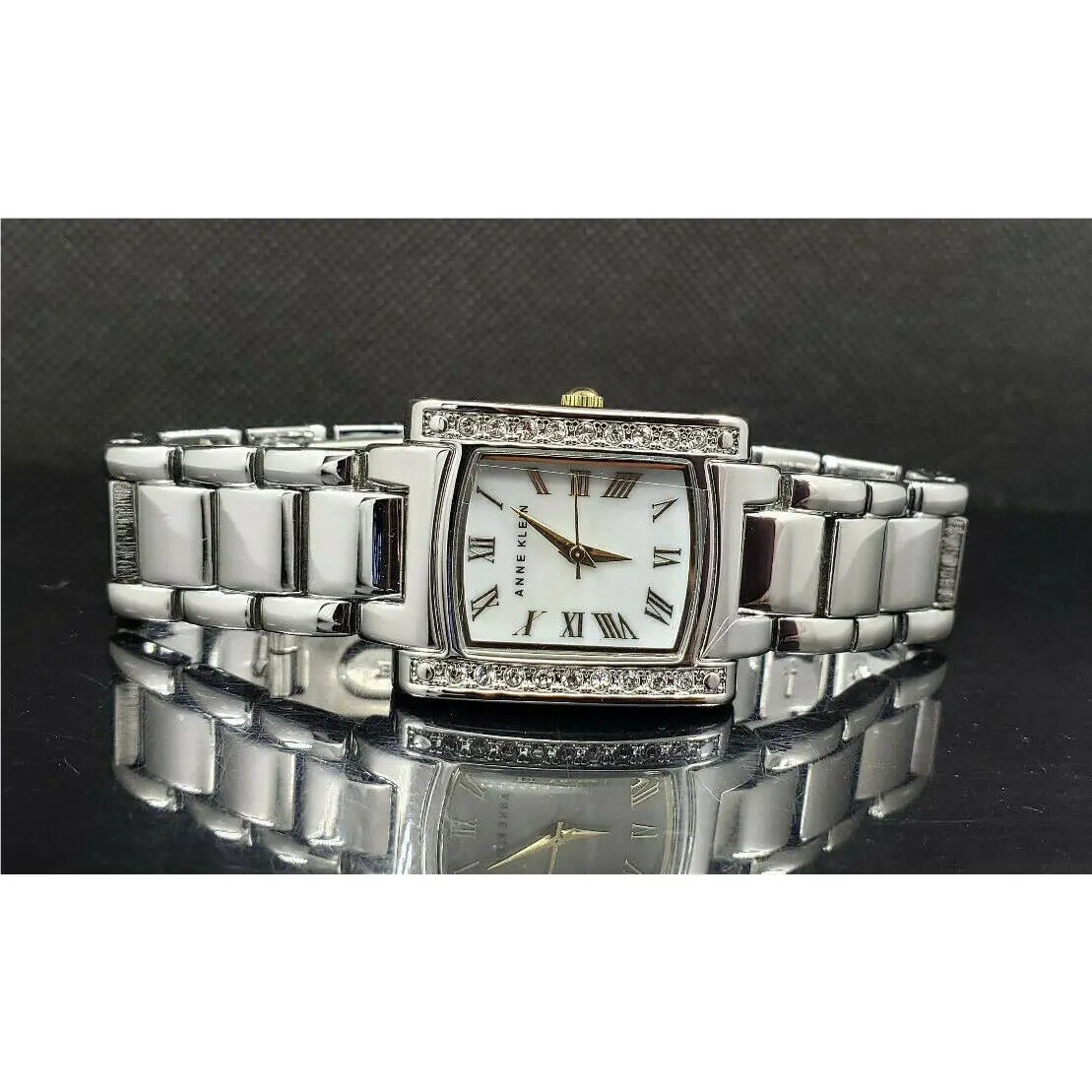 Anne Klein AK/1699MPTT Crystal Accented Mother-of-pearl Dial Women`s Watch