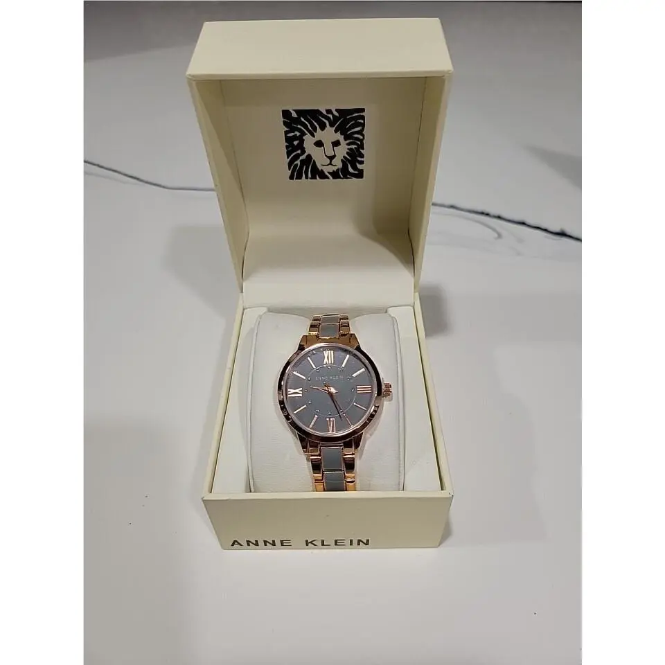 Anne Klein Women`s Rose Gold-tone and Light Pink Resin Bracelet Watch