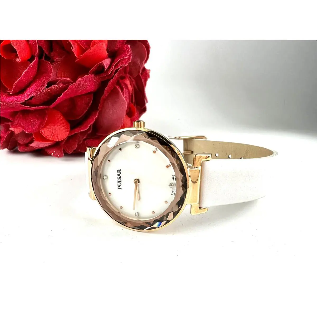 Pulsar Woman’s Watch Faceted Crystal Rose Gold Tone White Band Swarovski Crystal