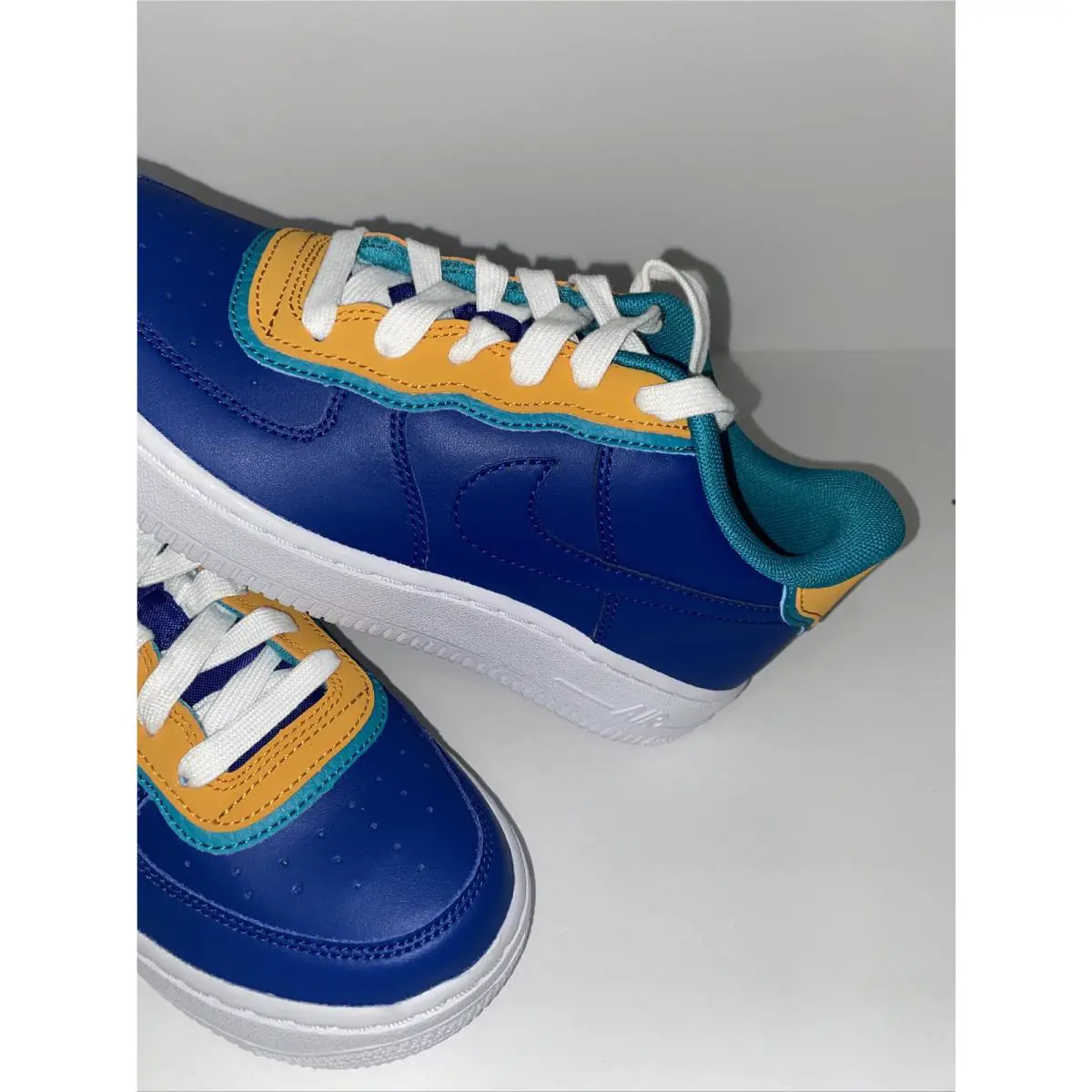 Nike shoes - Indigo/Gold/Teal (UPC: 00192499850423) 0
