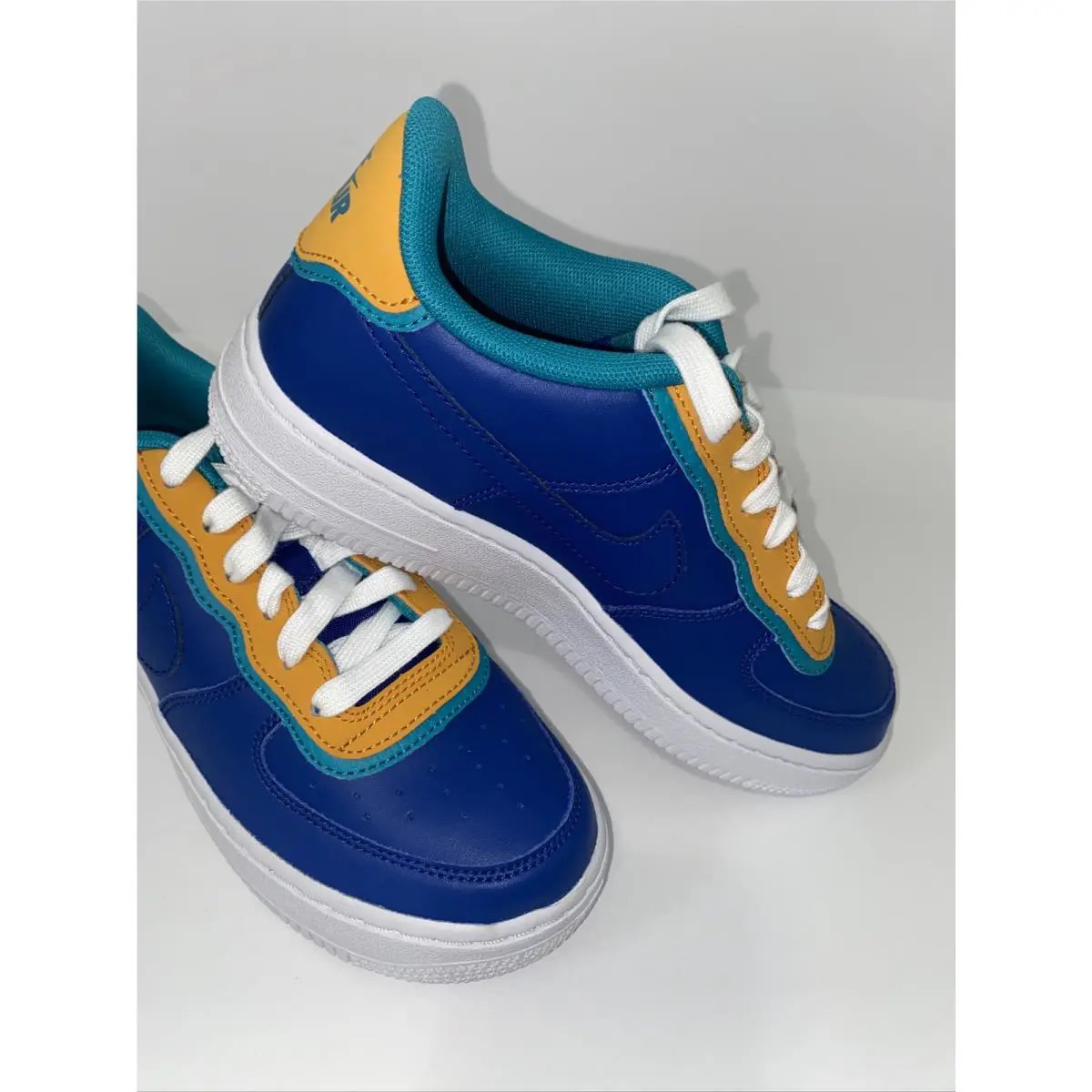 Nike shoes - Indigo/Gold/Teal (UPC: 00192499850423) 1