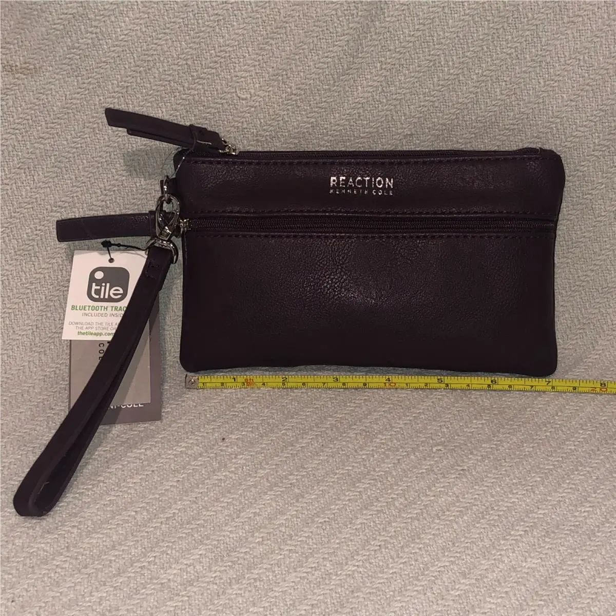 Reaction Wristlet Wallet with Tile Bluetooth Tracker Blackberry Purple by Kenneth Cole