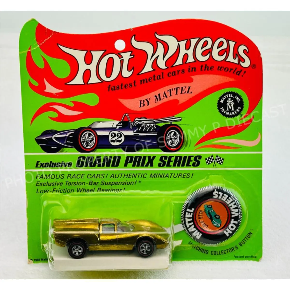 Hot Wheels Redline Lola GT70 Gold US V-stripe Button in Blisterpack