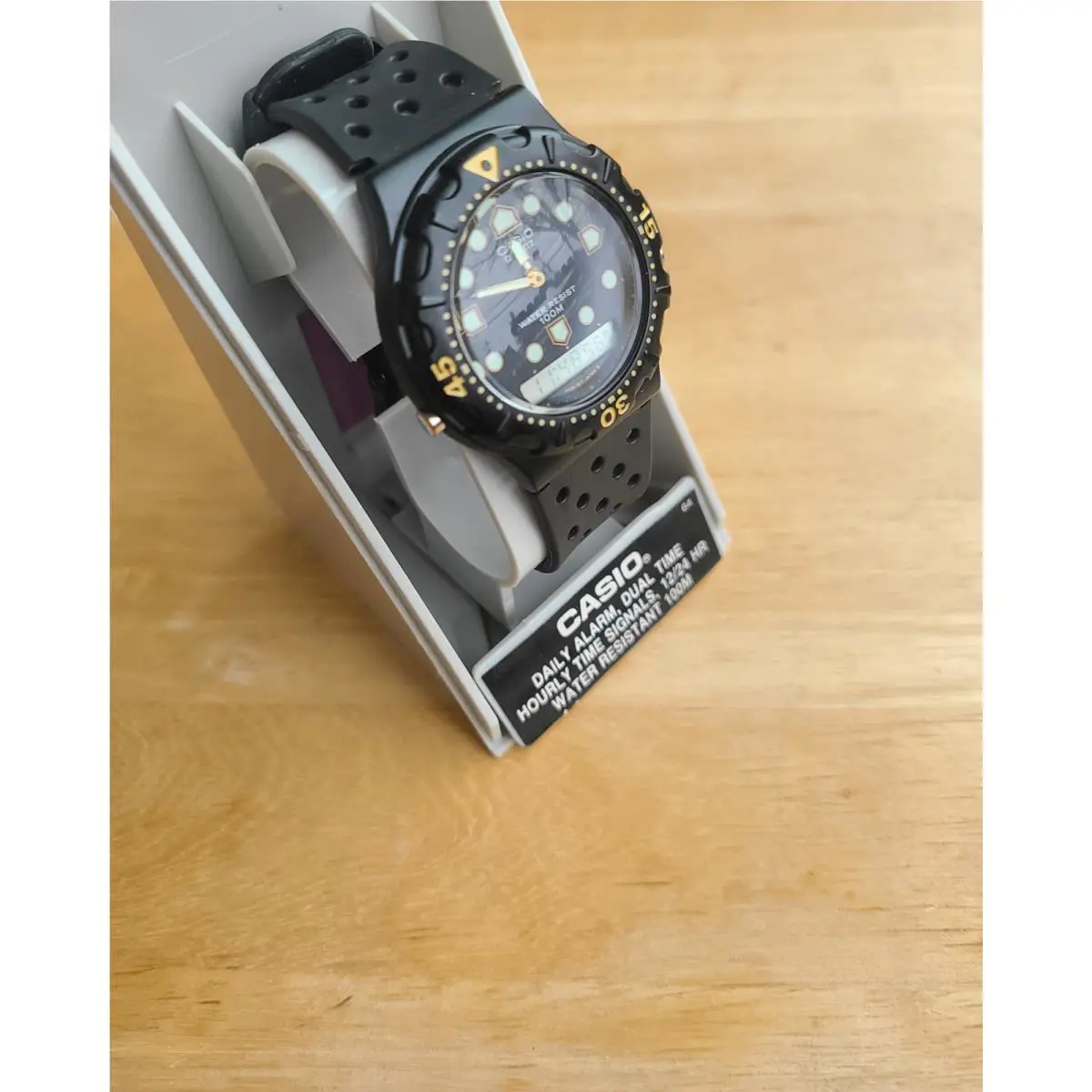 Casio Black and Gold Vintage Analog/digital Watch with Greenish White Round Indices