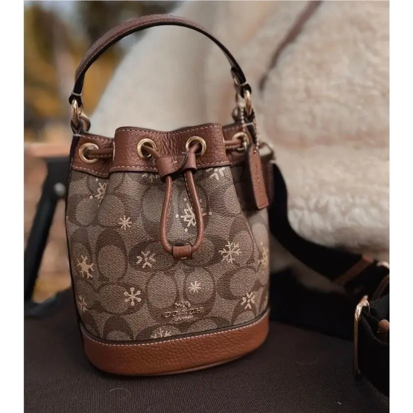 Coach Dempsey Drawstring Bucket Bag 15 In Signature Canvas with Snowflake Print