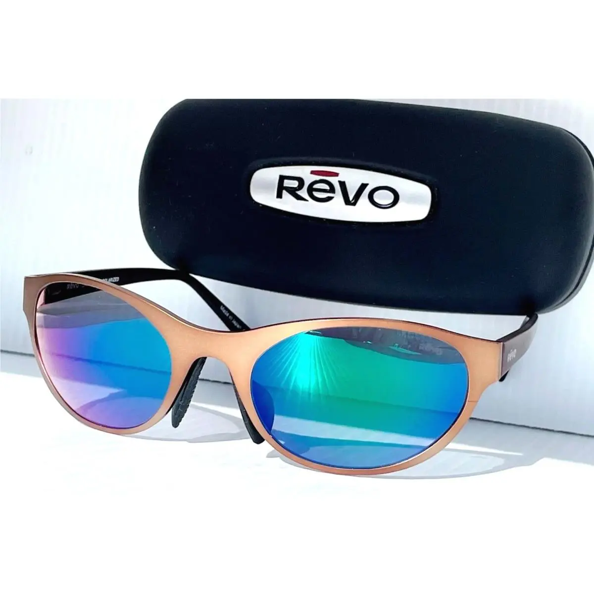Revo Icon Oval Satin Bronze Polarized Photochromic Green Sunglass 1197 02 Gnp