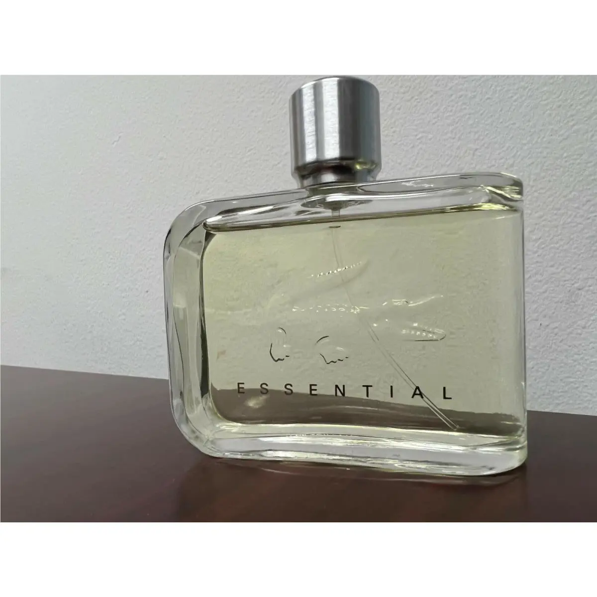 Lacoste Essential by Lacoste 4.2 FL oz / 125 ML Eau De Toilette Unboxed with Top