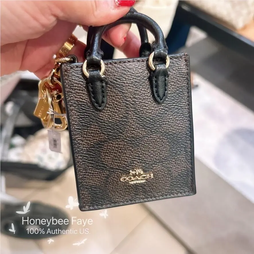 North/south Mini Tote Bag Charm In Signature Canvas CX069/CX074/CU280 CX069 Gold/Walnut/Black by Coach