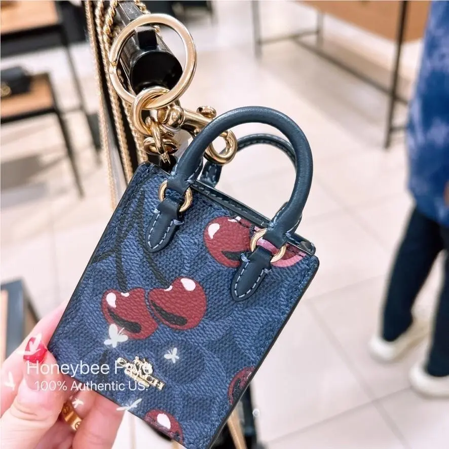 North/south Mini Tote Bag Charm In Signature Canvas CX069/CX074/CU280 CZ084 Gold/Denim Multi by Coach