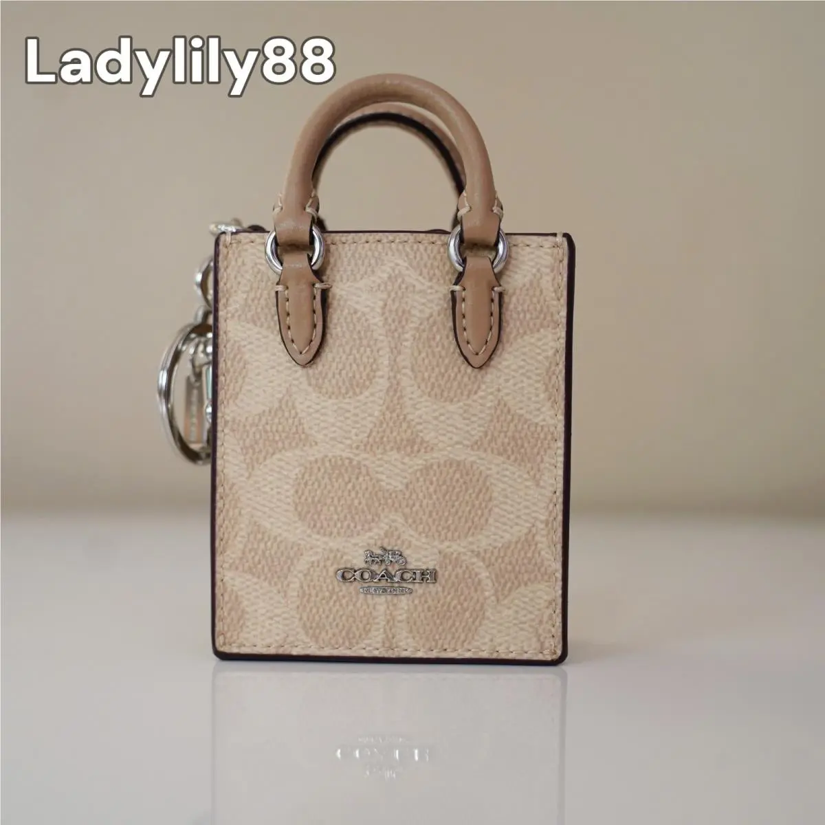 CU280 CU281 CX069 North/south Mini Tote Bag Charm In Signature Canvas CX069-SVPWH by Coach