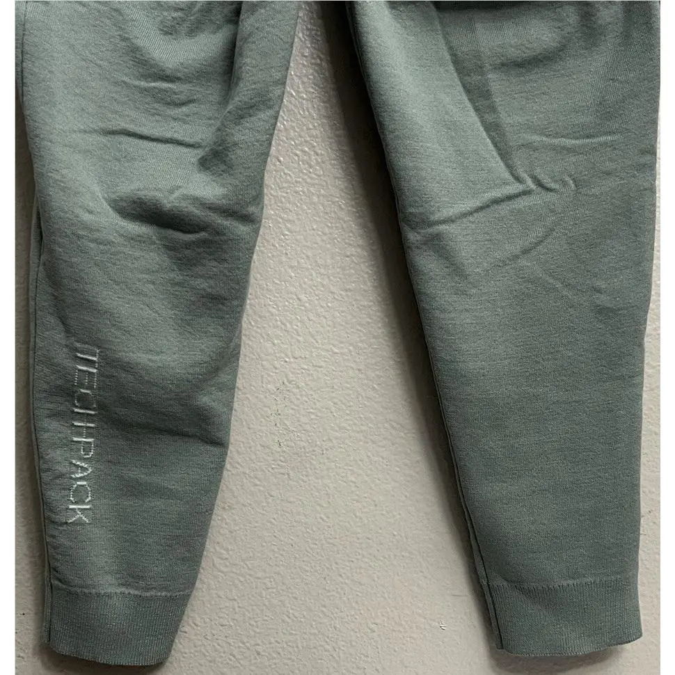 Nike clothing - Nike Therma-Fit Tech Pack Engineered Pants - DV9987-330 - Mica Green (UPC: 196153449626) 1