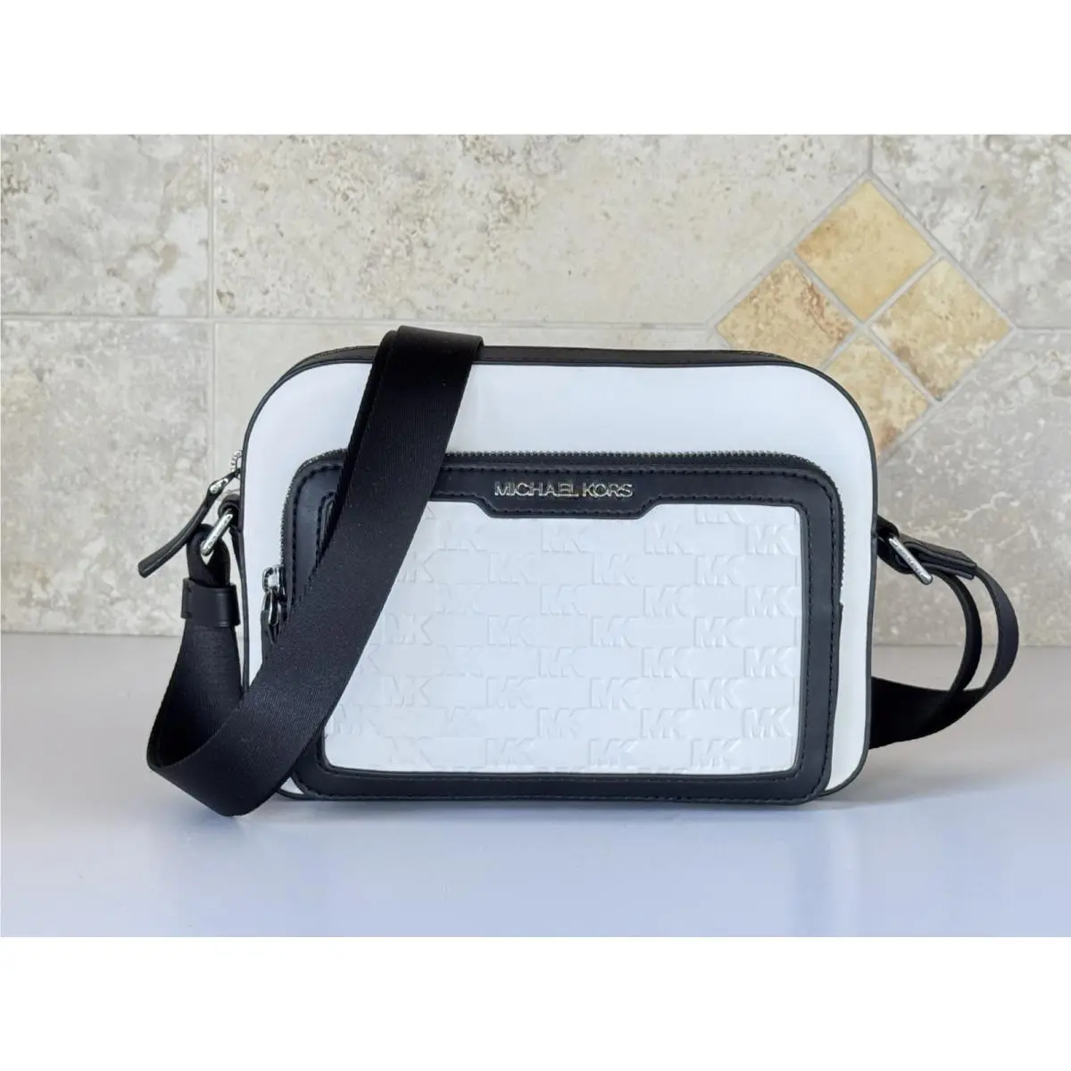 Michael Kors Cooper East West Crossbody Flight Bag MK Embossed Bright White