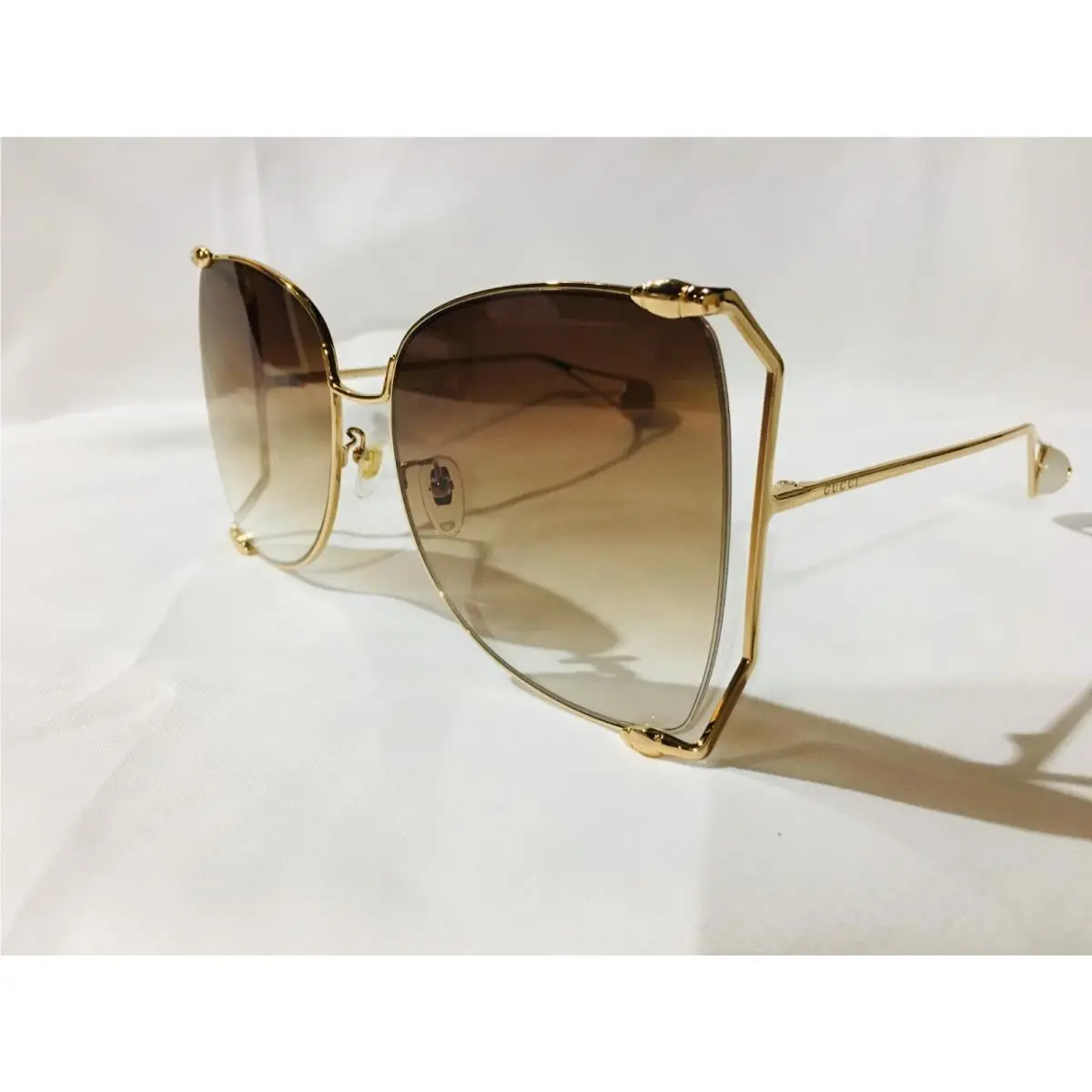 Gucci GG0252S Women`s Gold Brown Lens Butterfly Sunglasses