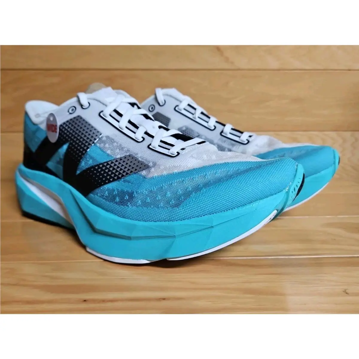 New Balance shoes - New Balance FuelCell Rebel v4 - WFCXCJ4 - Blue, Manufacturer: Cyber Jade/Black/White (UPC: 197966442729) 0