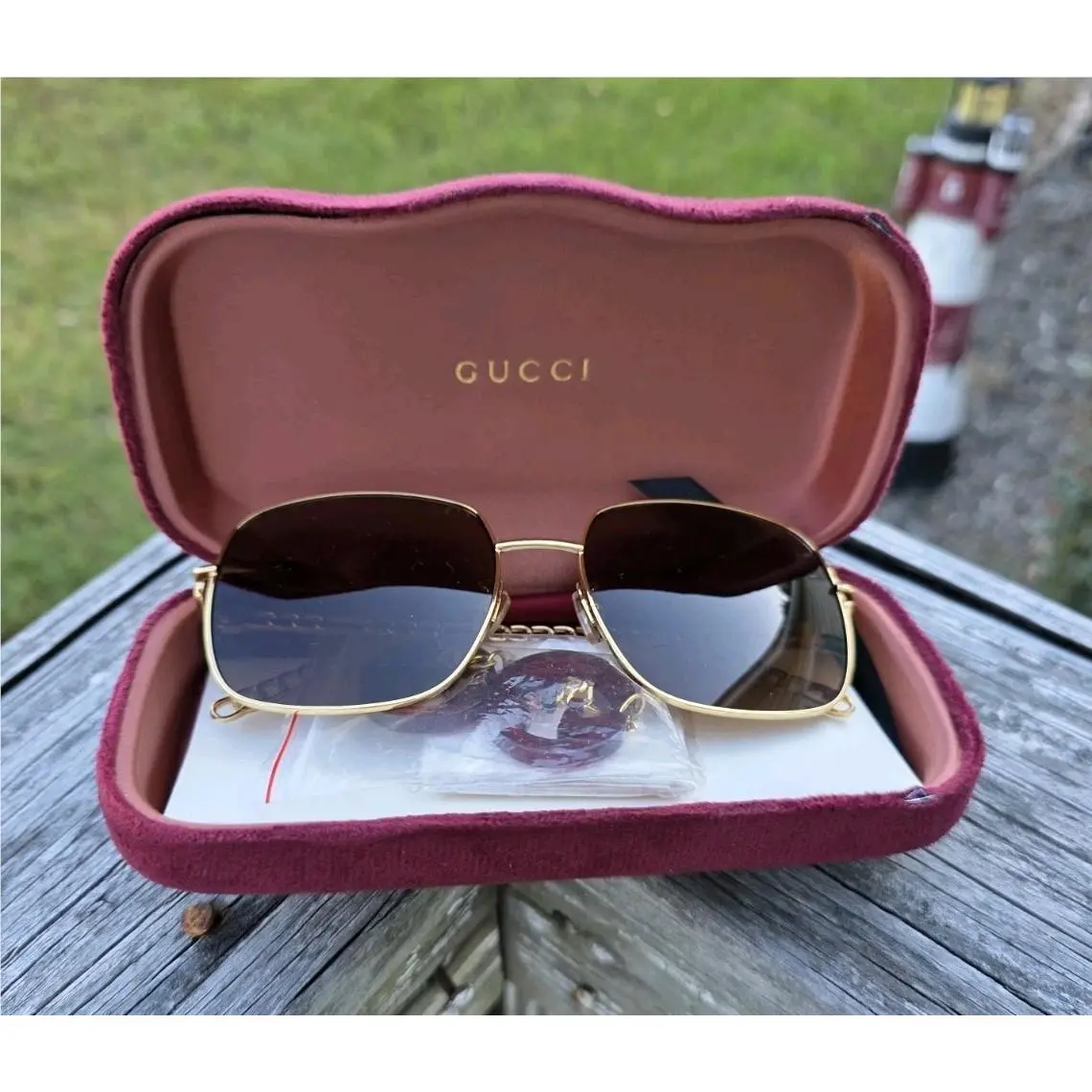 Gucci GG0724s Gold Frame with Bronze Lenses Hanging Charms AC13048471