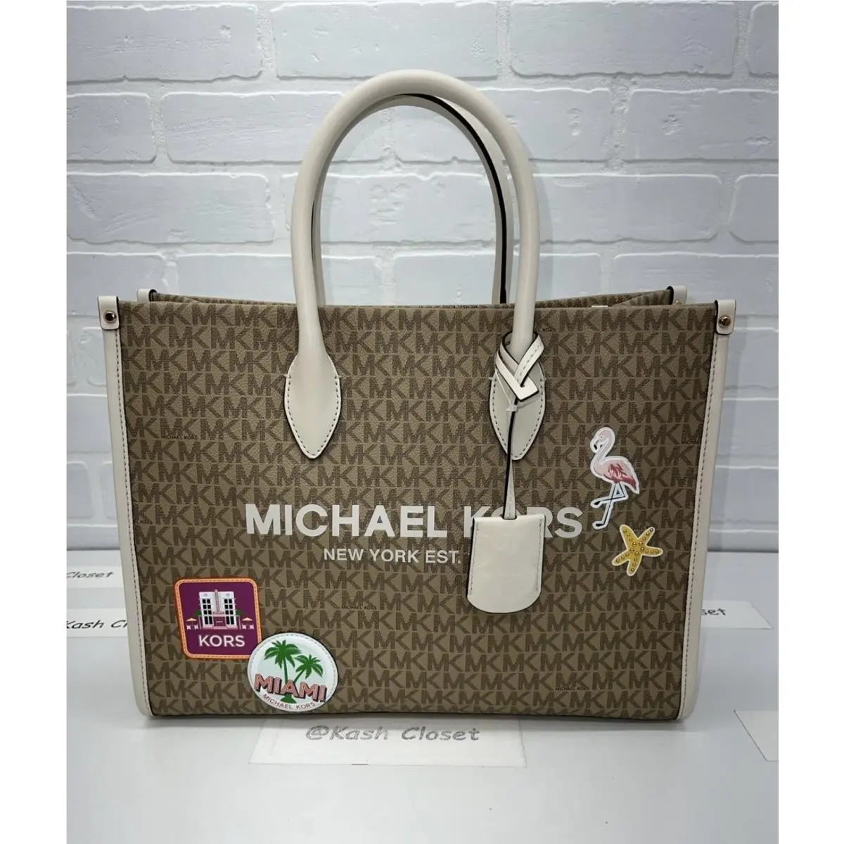 Mirella Medium EW Tote Bag Lt Cream with patch by Michael Kors