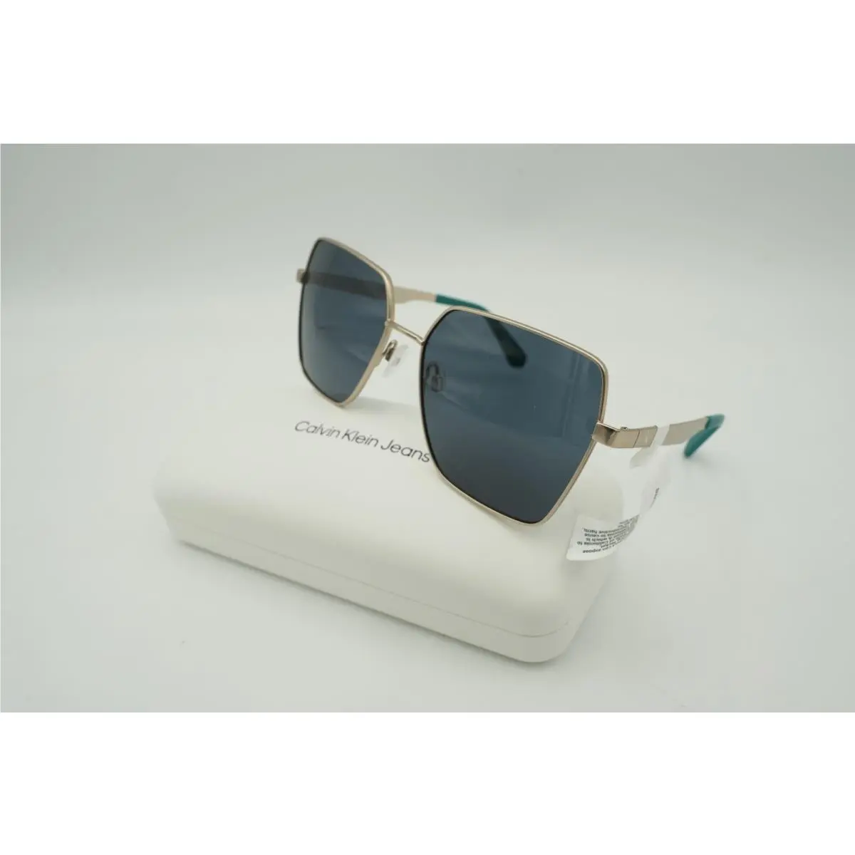 CKJ24201S Sunglasses 717 Gold Turquoise Tipped Ear Piece by Calvin Klein
